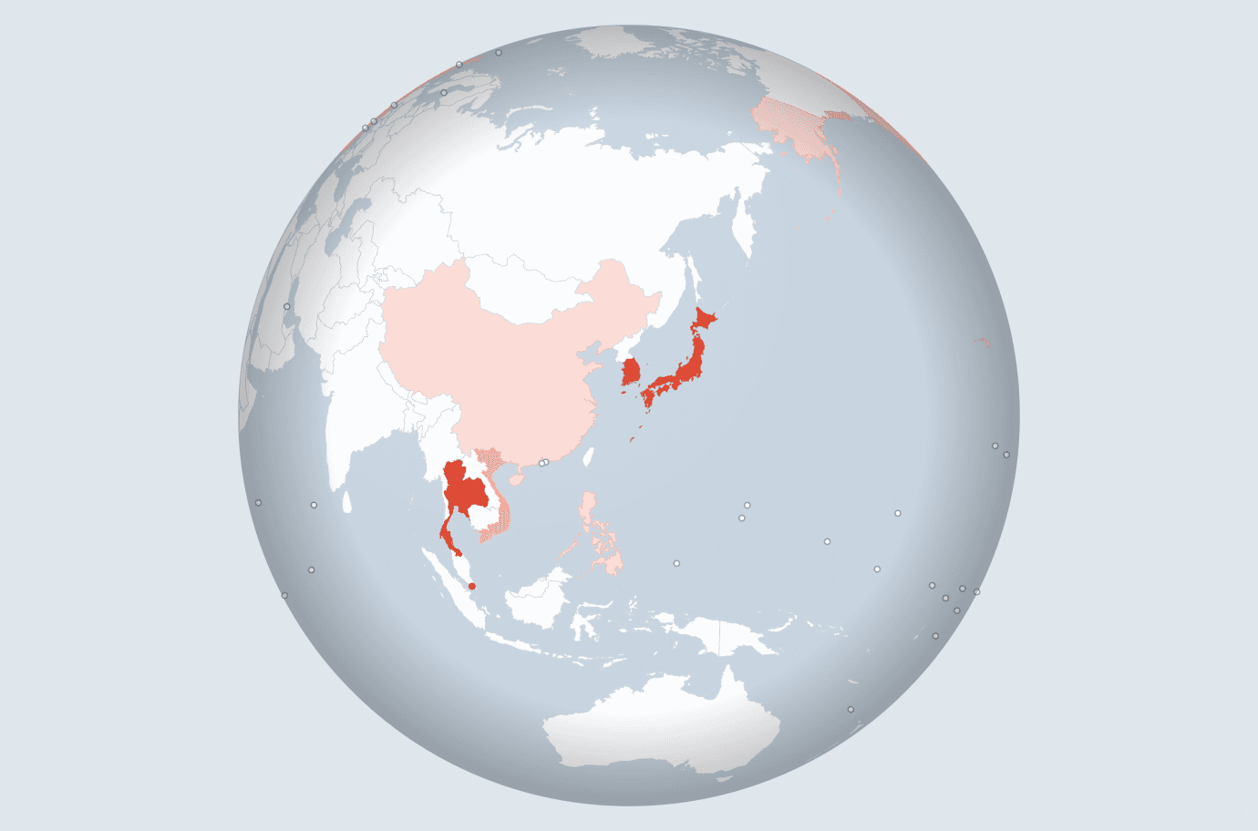 A globe turned toward Asia. Korea, Japan and Thailand are deep orange, Vietnam and the Philippines lighter, and China palest pink